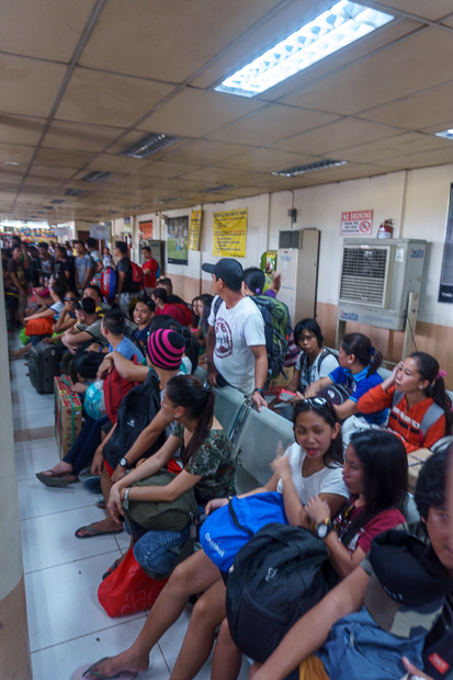 The journey beings at the Cebu South Bus Terminal where there is a long line for the bus going to Oslob. Most of the people here are probably going Whale Shark Watching in Oslob and the rest probably just want to go home to their hometowns for the weekend. In any case, the place is packed. (ISO 100 16mm f / 3.5 1/20sec)